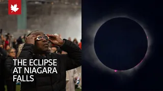 Total eclipse peeks through clouds at Niagara Falls