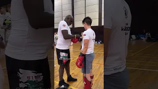 Ernesto Hoost helps a SENSHI camp participant before training | 19.04.2024 Varna, Bulgaria