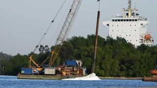 Reinforcing the Riverbed: Installing Iron Piles Along the Busy Path of Container Ships