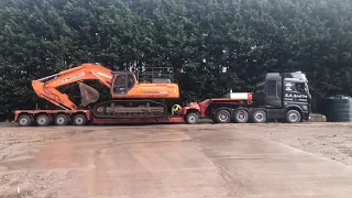 DCS Logistics Abnormal Load Escort Services - Unloading a DOOSAN DX520 Demolition Machine