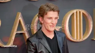 Ewan Mitchell poses on the red carpet for the London Premiere of 'House of the Dragon [August, 2022]