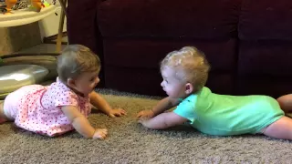 Laughing 9-month-old Twins