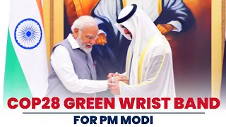 UAE President Sheikh Mohamed bin Zayed Al Nahyan gives COP 28 green wrist band to PM Modi