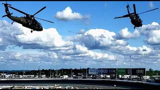 Military helicopters circle the NASCAR Cup Series at   Charlotte Motor Speedway Coca cola 600 race