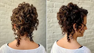 High Bun with Natural Curls! Achieve gorgeous, glossy curls when working with naturally curly hair.