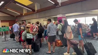 Thousands stranded in Maui airport as wildfires scorch island