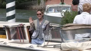 Kristen Stewart arrives by boat at the Excelsior Hotel posing with fans