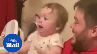 Baby pretending to use phone gets shock when it rings