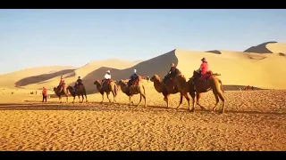 Camel ride in Gobi Desert along Silk Road in Dunhuang, China.