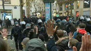 Riot police charge to try to push back Paris security law protesters | AFP