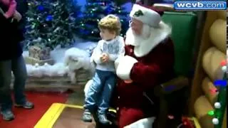 Santa uses sign language with deaf boy