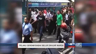 Pelaku Gendam Babak Belur Dihajar Warga - NET. JATIM