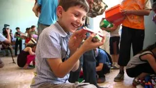 Georgian Boy Plays His Harmonica - Operation Christmas Child
