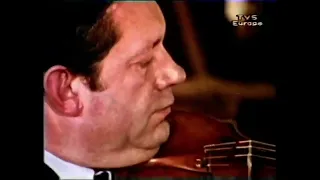 Arthur Grumiaux testing a violin