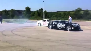 Toyota Supra drift around Bugatti Veyron