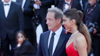 Vincent Lindon and Deepika Padukone pose together on the red carpet at the #ArmageddonTime premiere