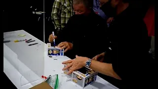 William Shatner from Star Trek signing autographs and not talking to fans in line.