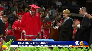 Paralyzed high school student walks across graduation stage