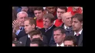 Kenny Dalglish gets a standing ovation. He looks distraught, tries a weak smile