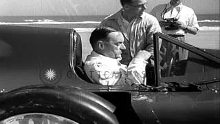 Sir Malcolm Campbell sets a speed record in his Bluebird car at Daytona Beach, Fl...HD Stock Footage