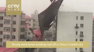 Footage: Strong wind blows off building roof