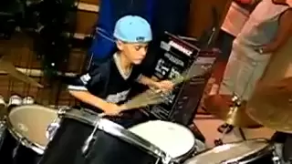 Justin Bieber playing the drums at age 9