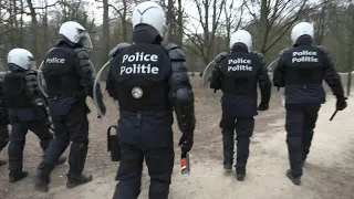 Riot police deployed for a second evening in Brussels park | AFP