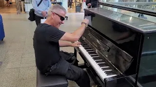 Dr. K plays boogie woogie for me in St. Pancras station