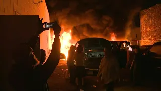 Cars set ablaze in Minneapolis as protesters ignore curfew orders | AFP