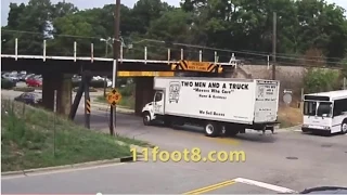 Two men and a truck that almost fit under the 11foot8 bridge