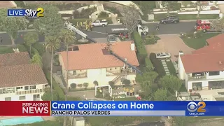 Crane Collapses On Home