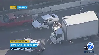 Driver weaves through freeway traffic during wild police chase