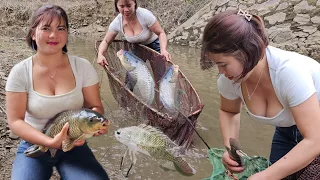 When the lake water recedes, the girl has the opportunity to block the stream to catch fish to sell.