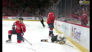 Nolan Patrick flies to the boards after a shoulder hit by Ovechkin