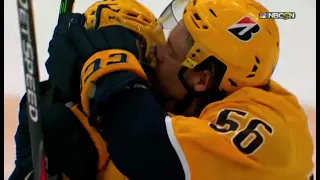 Erik Haula kissing Luke Kunin