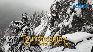 Tourists enjoy fresh snowfall at Gulmarg