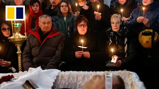 Mourners gather as Russian opposition leader Navalny laid to rest