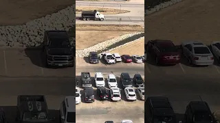 Driver panics and hits car multiple times in parking lot.