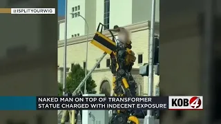 Man arrested after climbing Transformer statue and taking his clothes off