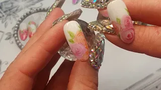 Watercolour rose nail art using soft tip markers.