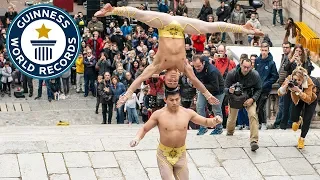 Most stairs climbed while balancing a person on the head - Guinness World Records