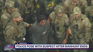 Police pose with escaped murder Danelo Cavalcante after manhunt