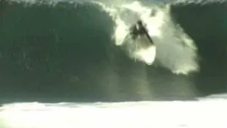 Surfers getting shacked while surfing at Backdoor in Hawaii