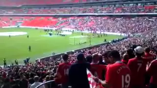 Manchester United fans singing Glory Glory at wembley .