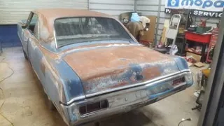 Abandoned 1971 Plymouth Scamp in the shop