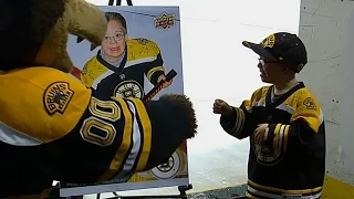 Young Bruins superfan receives hockey card