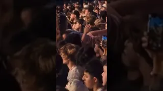 A woman crowd surfs @ Vince Staples performance