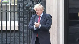 British PM Boris Johnson joins 'Clap for Carers' tribute on Downing Street | AFP