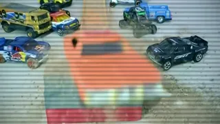 Hot wheels jump and crashes in slow motion.