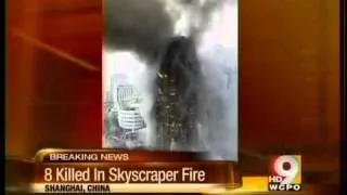 China high-rise fire kills 8, injures 90